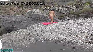 She stuffs stones in ass and pussy on nudist beach