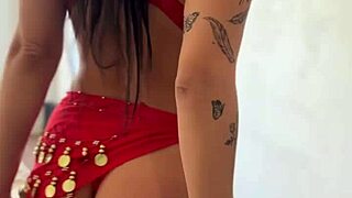 Brunette with stunning ass and thick thighs dances as tension builds