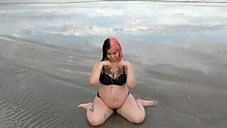 Hey pregnant beauty sensually sways on beach