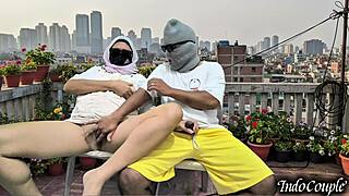 Balcony beauty begs for hairy pussy touch outdoors