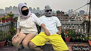 Balcony beauty begs for hairy pussy touch outdoors