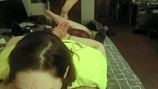 Redhead slave lays prone deepthroating master's cock