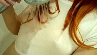 Redhead teen 18+ soaks in steamy bath revealing tattoos and curves