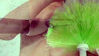 Perverse Milf Stretches Pussy Wildly With Glove And Cleaner Brush