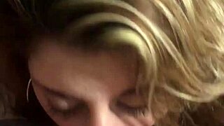 hot milf kneels sucking her husband's throbbing cock hungrily