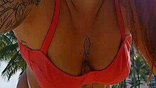 african exhibitionist flashes teasing males while recording beach video provocatively