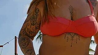 african exhibitionist flashes teasing males while recording beach video provocatively