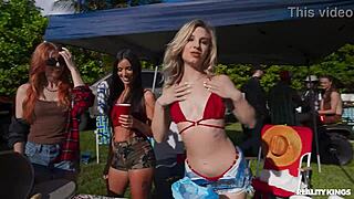 blonde party slut chokes on huge cock in the bush