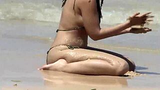 check out her teasing ass on that caribbean beach shore