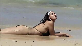 check out her teasing ass on that caribbean beach shore