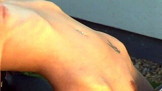 Blonde bombshell in fishnets fingers herself for biker's fantasy