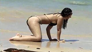 check out her teasing ass on that caribbean beach shore