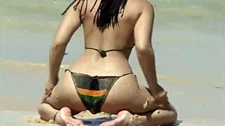 check out her teasing ass on that caribbean beach shore