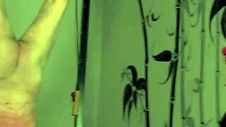 Redhead mistress dominates bound sub in latex bodysuit
