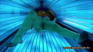 Beautiful woman rubs her pussy wildly on solarium cam