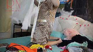 WATCH THIS CURVY BRUNETTE HOUSEWIFE TEASE IN LINGERIE ON BED STRIPPING PUSSY LIPS BARE!