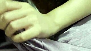 cute asian girlfriend strokes boyfriend's cock with expert handjob skill