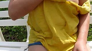 Erika flashes big tits outdoors in public park