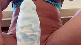 Watch this muscular blonde MILF stretch her huge tits pussy with massive dildo