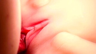 Teasing pink smooth shaved vagina up close