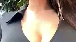 mature woman with big boobs walks outside