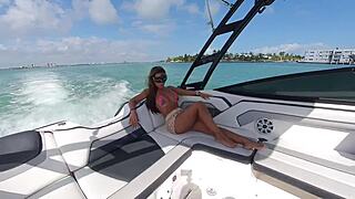 Bikini tease on a boat with big tits
