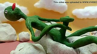 Alien monster jerks huge cock outdoors with toys