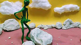 Alien monster jerks huge cock outdoors with toys