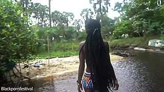 Skinny African woman with perfect body stands in forest