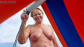 mature woman swims naked outdoors