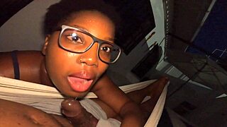 Nose pierced afro girl sucks dick in hammock